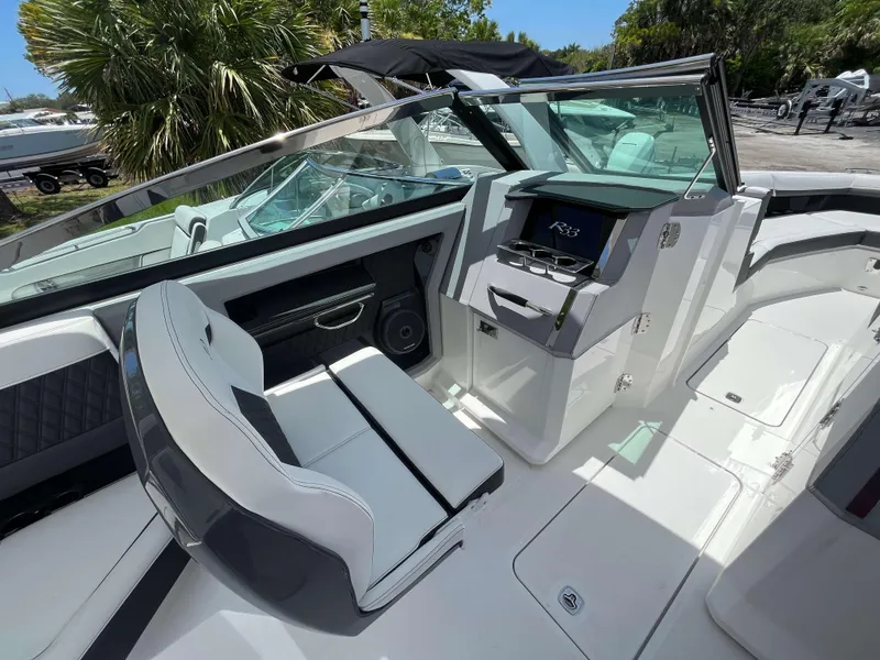 Slide: The Image of Interior of 2023 Cobalt R33 boat with modern seating and dashboard. - 6