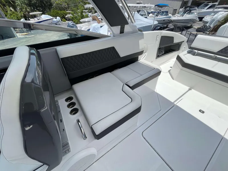 Slide: The Image of Interior of 2023 Cobalt R33 boat with sleek white seating and modern design. - 9
