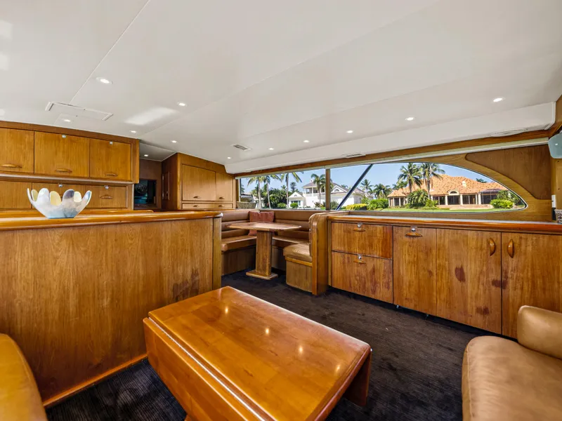 Slide: The Image of Luxurious interior of a 1990 Buddy Davis 61 Convertible yacht with wooden furnishings. - 14