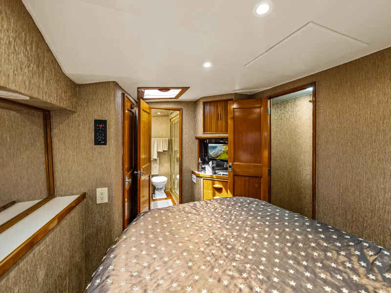 Slide: The Image of Interior cabin of a 1990 Buddy Davis 61 Convertible yacht with bed and bathroom. - 19