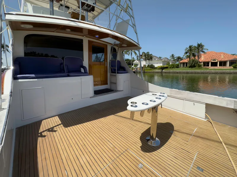 Slide: The Image of 1990 Buddy Davis 61 Convertible yacht with spacious deck and seating area. - 28