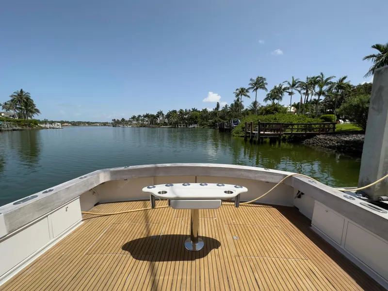 Slide: The Image of View from the deck of a 1990 Buddy Davis 61 Convertible yacht on a serene waterway. - 30