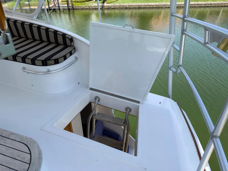 Slide: The Image of Open hatch with ladder on 1990 Buddy Davis 61 Convertible yacht. - 34