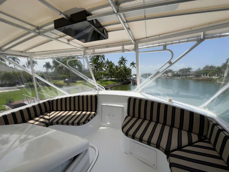 Slide: The Image of Interior view of 1990 Buddy Davis 61 Convertible yacht with striped seating. - 41