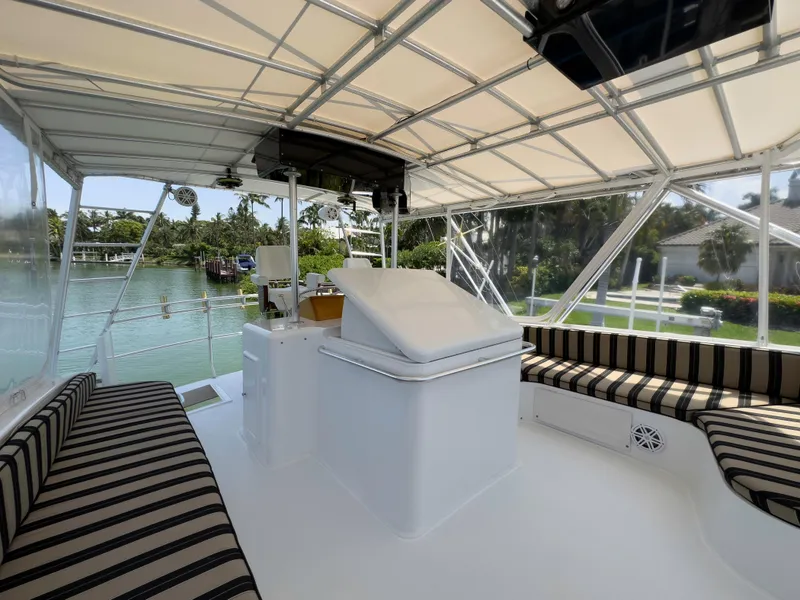 Slide: The Image of Interior view of 1990 Buddy Davis 61 Convertible yacht with striped seating. - 42