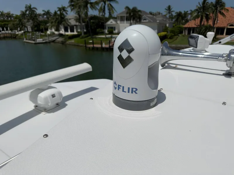Slide: The Image of FLIR camera on 1990 Buddy Davis 61 Convertible yacht, docked near waterfront homes. - 46