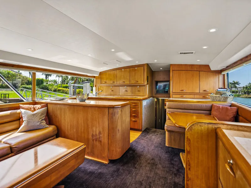 Slide: The Image of Luxurious interior of a 1990 Buddy Davis 61 Convertible yacht with wooden furnishings. - 5
