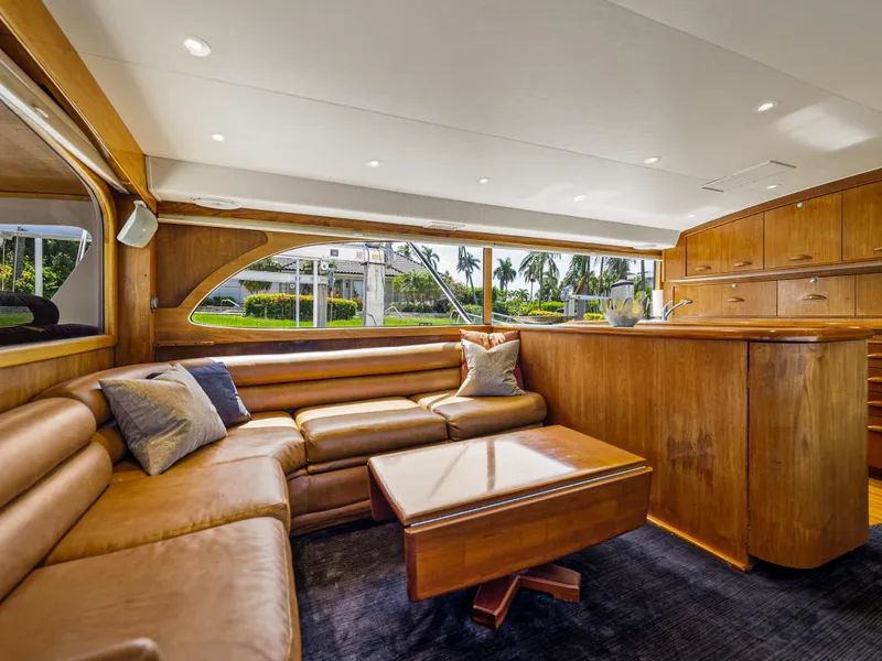 Slide: The Image of Luxurious interior of 1990 Buddy Davis 61 Convertible yacht with leather seating and wooden finishes. - 6