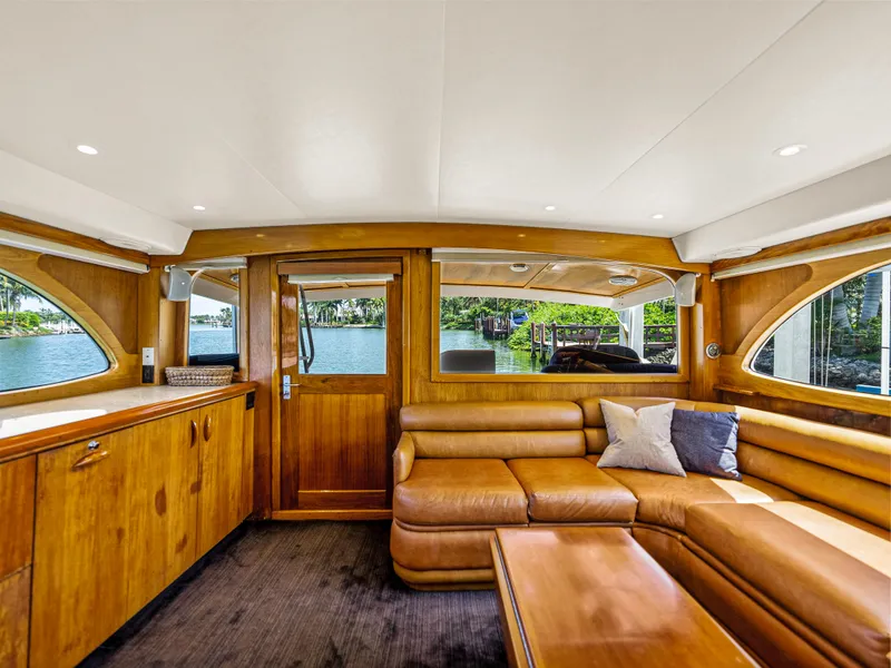 Slide: The Image of Interior of 1990 Buddy Davis 61 Convertible yacht with leather seating and wooden cabinetry. - 8