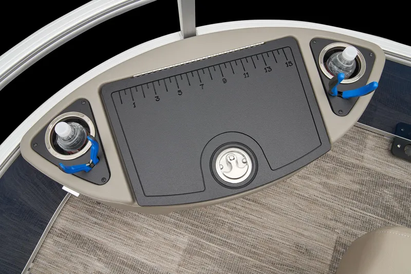 Slide: The Image of 2024 Ranger Reata 220F boat console with cup holders and measuring board. - 19