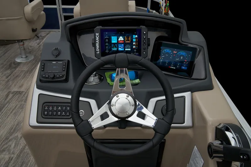 Slide: The Image of 2024 Ranger Reata 220F boat dashboard with steering wheel and electronic displays. - 24