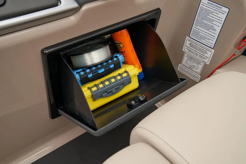 Slide: The Image of Storage compartment on 2024 Ranger Reata 220F boat with safety equipment and accessories. - 28