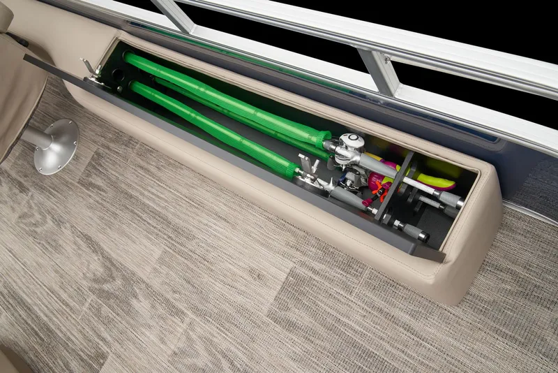 Slide: The Image of 2024 Ranger Reata 220F boat storage compartment with fishing rods. - 40