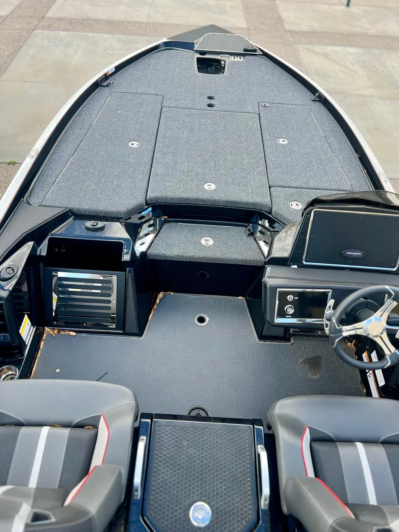 Slide: The Image of 2024 Ranger Z520R boat interior with advanced dashboard and seating. - 3