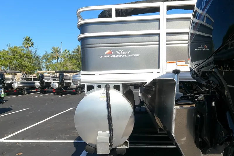 Slide: The Image of 2024 Sun Tracker Fishin' Barge 22 XP3 pontoon boat in a parking lot. - 15