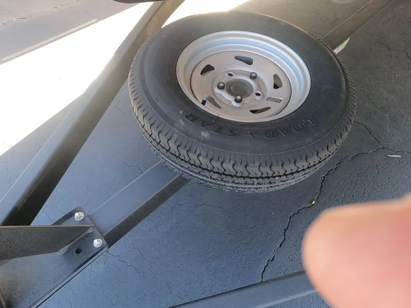 Slide: The Image of Spare tire on a 2024 Sun Tracker Fishin' Barge 22 XP3 trailer. - 3