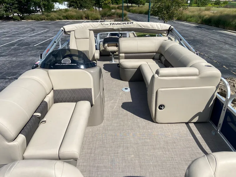 Slide: The Image of 2023 Sun Tracker Fishin' Barge 22 DLX pontoon boat with spacious seating and canopy. - 3