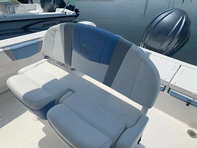 Slide: The Image of 2022 Robalo R230 boat seating and deck area. - 16