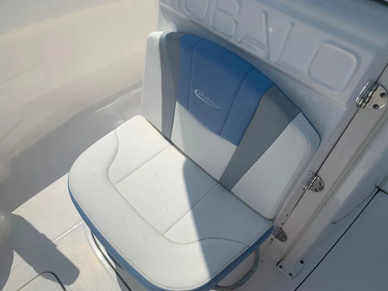Slide: The Image of 2022 Robalo R230 boat seat with blue and white upholstery. - 25