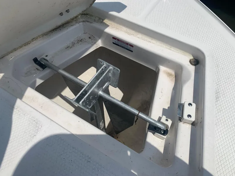 Slide: The Image of Anchor storage compartment on a 2022 Robalo R230 boat. - 26