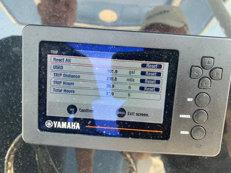 Slide: The Image of Yamaha trip monitor on 2022 Robalo R230 boat showing fuel usage and trip data. - 8