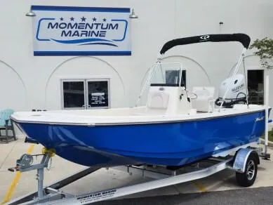 The Image of 2023 Sundance DX20 boat on trailer at Momentum Marine dealership. - 0