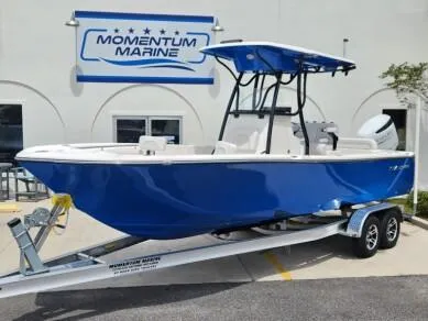 The Image of 2023 Sea Born LX 24 LE boat on trailer at Momentum Marine dealership. - 1