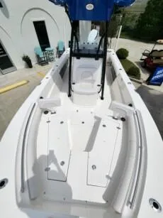 Slide: The Image of 2023 Sea Born LX 24 LE boat interior with seating and storage compartments. - 11