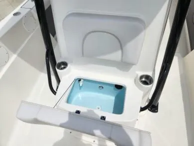 Slide: The Image of 2023 Sea Born LX 24 LE boat interior with open storage compartment. - 12