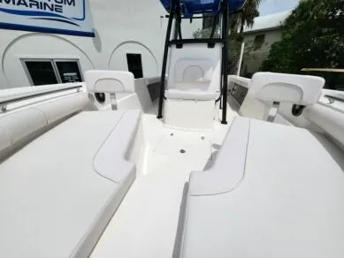 Slide: The Image of 2023 Sea Born LX 24 LE boat interior with white seating and center console. - 5