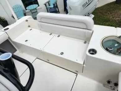 Slide: The Image of 2023 Sea Born LX 24 LE boat interior with seating and storage compartments. - 8
