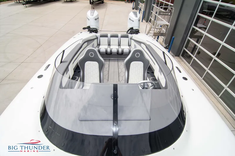 Slide: The Image of 2023 Fountain 34 Thunder Cat boat with modern seating and dual outboard engines. - 12