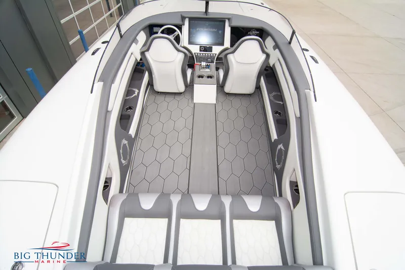 Slide: The Image of 2023 Fountain 34 Thunder Cat interior with modern seating and dashboard, Big Thunder Marine. - 14