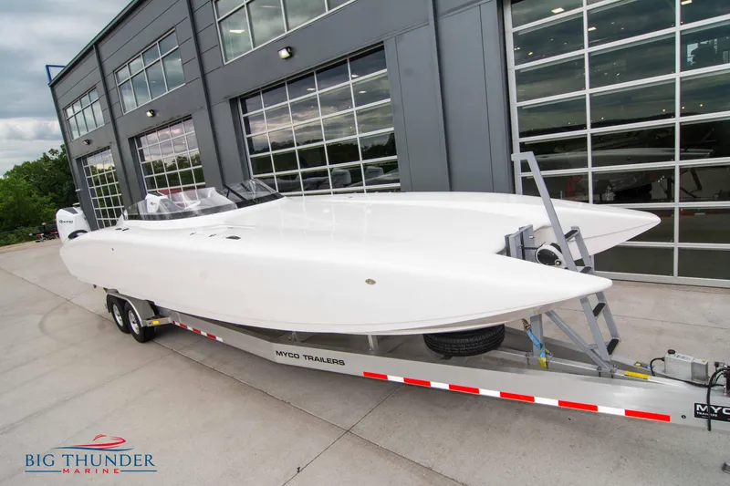 Slide: The Image of 2023 Fountain 34 Thunder Cat boat on trailer outside Big Thunder Marine. - 3