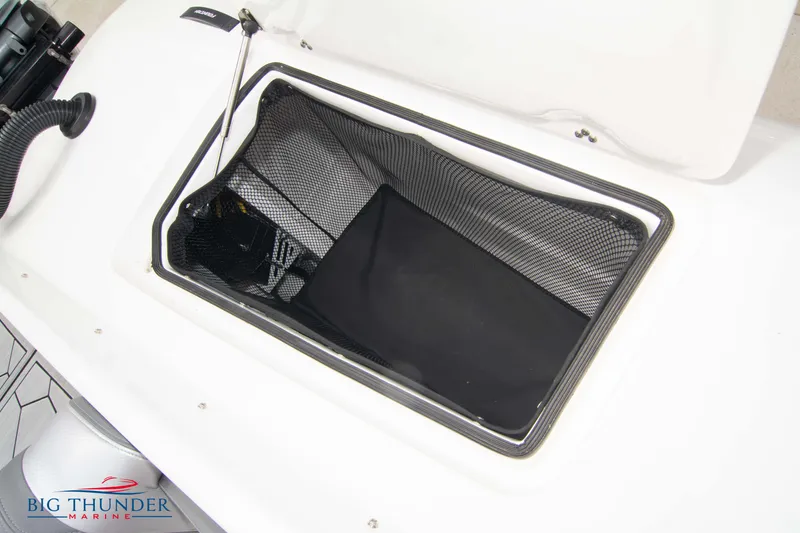 Slide: The Image of 2023 Fountain 34 Thunder Cat storage compartment with mesh netting. - 30