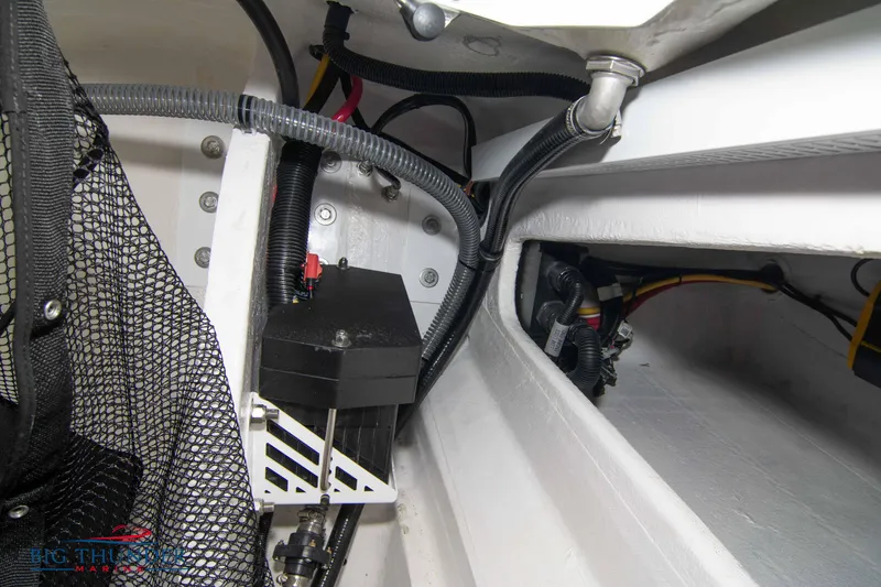 Slide: The Image of 2023 Fountain 34 Thunder Cat engine compartment with wiring and components. - 34