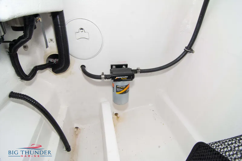 Slide: The Image of 2023 Fountain 34 Thunder Cat engine compartment with fuel filter and wiring. - 35