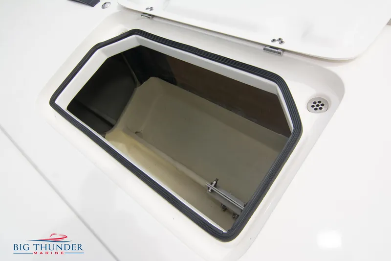 Slide: The Image of Open storage compartment on a 2023 Fountain 34 Thunder Cat boat. - 36
