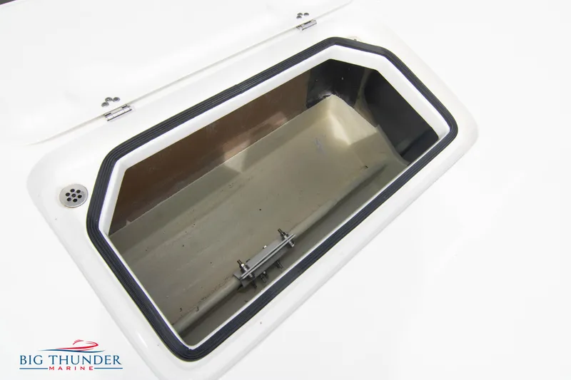 Slide: The Image of Open storage compartment on a 2023 Fountain 34 Thunder Cat boat. - 38