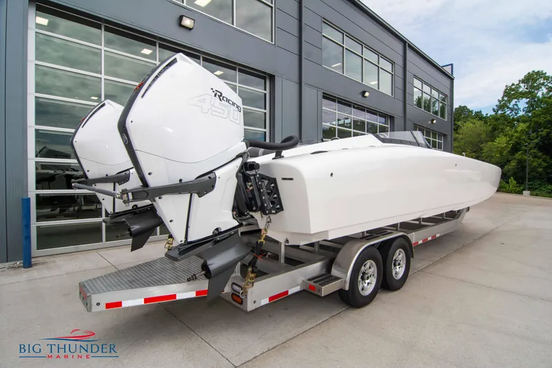 Slide: The Image of 2023 Fountain 34 Thunder Cat boat on trailer with twin outboard engines. - 5