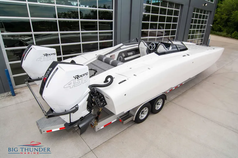 Slide: The Image of 2023 Fountain 34 Thunder Cat boat on trailer with twin outboard engines. - 6