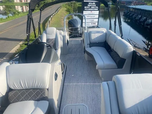 Slide: The Image of 2023 SunCatcher Elite 326 SS pontoon boat interior with plush seating and modern design. - 13