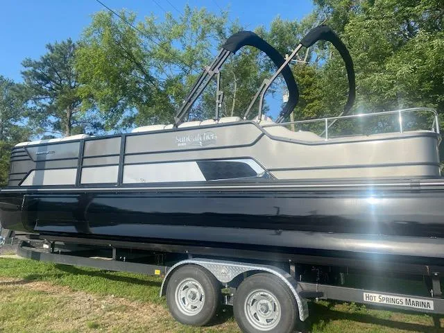 Slide: The Image of 2023 SunCatcher Elite 326 SS pontoon boat on a trailer at Hot Springs Marina. - 2