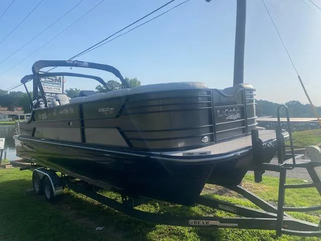 Slide: The Image of 2023 SunCatcher Elite 326 SS pontoon boat on a trailer. - 3