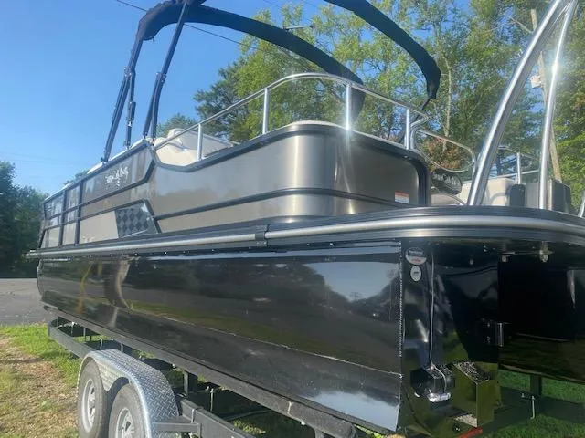 Slide: The Image of 2023 SunCatcher Elite 326 SS pontoon boat on a trailer. - 4