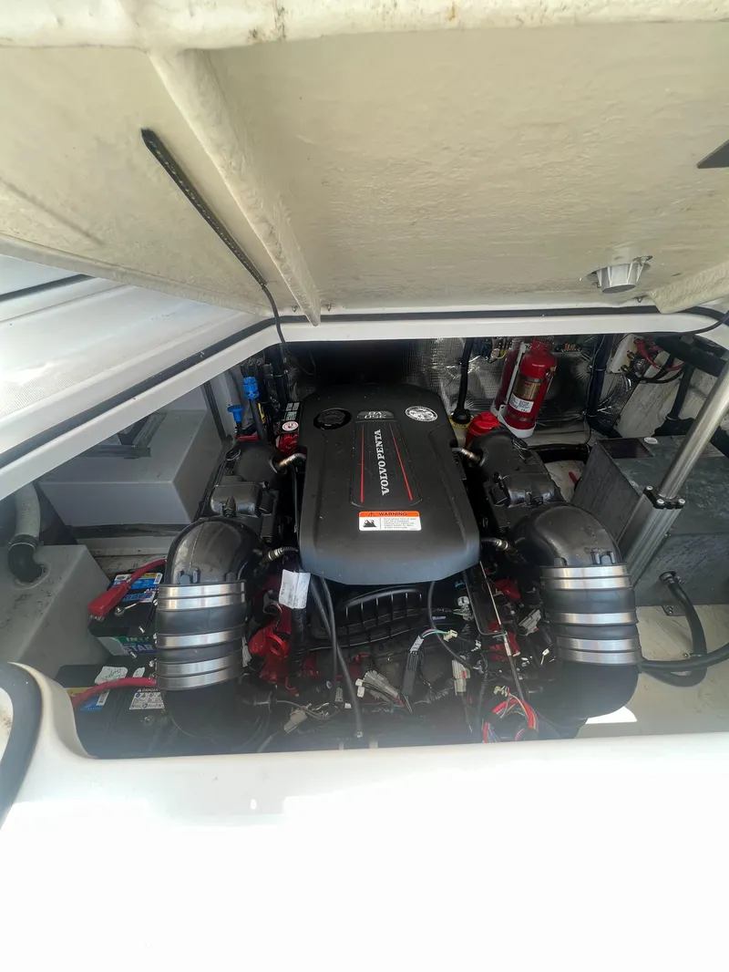 Slide: The Image of 2019 Regal 28 Express boat engine compartment with MerCruiser engine. - 44