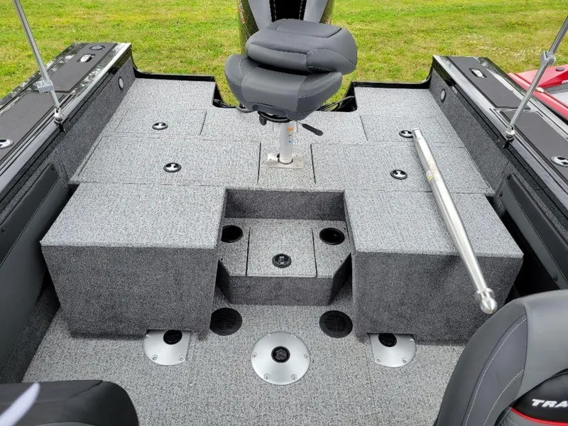 Slide: The Image of 2024 Tracker Targa V19 Combo boat interior with seating and storage compartments. - 2