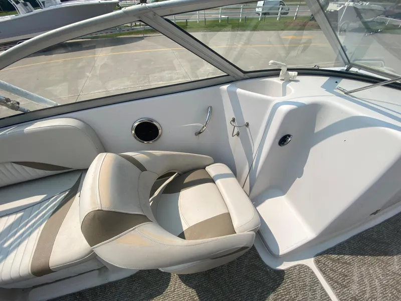 Slide: The Image of 2009 Starcraft 2410 OB Limited boat interior with seating and helm station. - 13