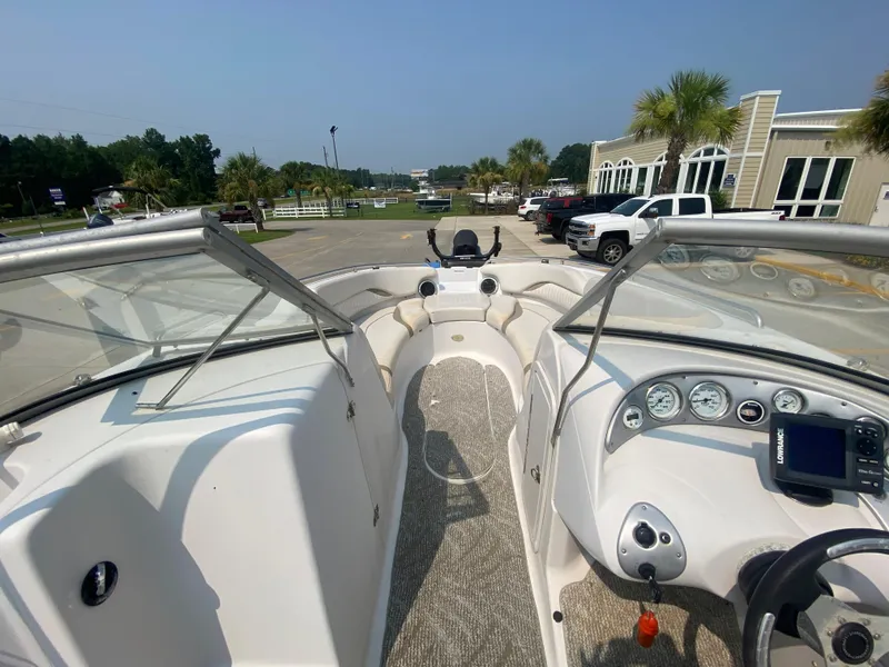 Slide: The Image of 2009 Starcraft 2410 OB Limited boat interior with dashboard and seating. - 14