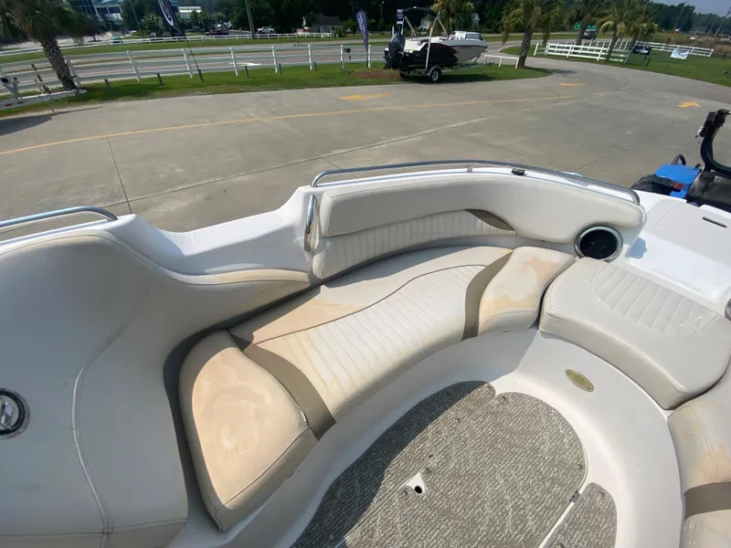 Slide: The Image of 2009 Starcraft 2410 OB Limited boat interior with white and beige seating. - 15